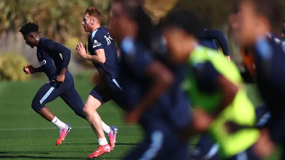 Spurs players running during training